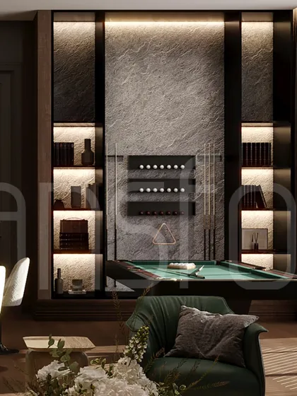 The entertainment section of the study, featuring a pool table and a backlit stone wall. This shows how a single room can be zoned for multiple functions, from work to leisure.