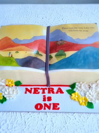 A different angle of the storybook cake, showing the thickness of the "pages."