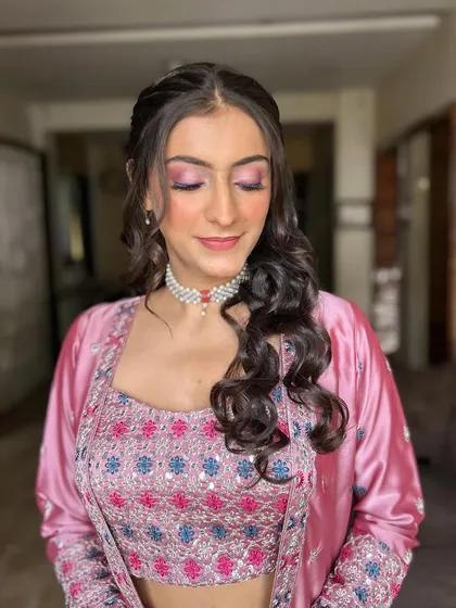 A close-up on the eye makeup, showing the soft blend of pink and purple shades. This adds a pop of color without being overwhelming.