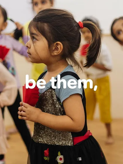 A young girl stands ready and attentive, representing the potential and strength we aim to unlock in every child.