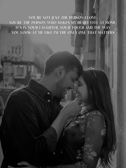 A deeply romantic black and white portrait from a Mumbai pre-wedding shoot. The added text beautifully expresses the emotion of the moment, highlighting how the right person makes you feel at home.