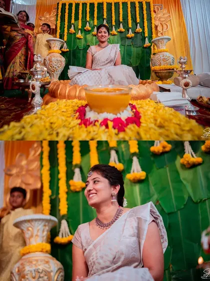 The bride seated amidst a beautiful Haldi decor of marigolds and banana leaves, ready for the ceremony to begin.