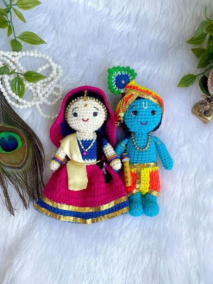 The divine couple, Radha and Krishna. I made this beautiful pair to celebrate the festival of Holi. Radha's lehenga and Krishna's turban are crafted with bright, festive colors.
