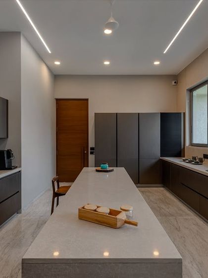 An overhead view of the island, which provides a large, uninterrupted surface for meal prep, serving, or casual dining. The minimalist design is both beautiful and practical.