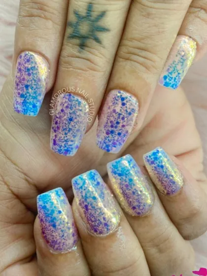 Get lost in this sparkling galaxy of color. We used a mix of blue and purple glitter to create this dazzling, multi-tonal look that is full of depth and shine.