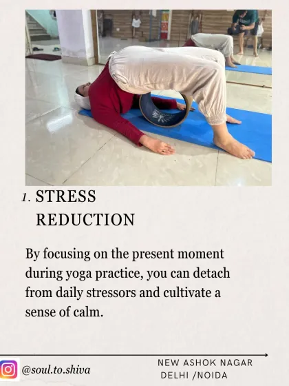 Benefit 1: Stress Reduction. By focusing on the present moment during your practice, you detach from daily stressors. Here, a student uses a yoga wheel to gently open the spine and release tension.