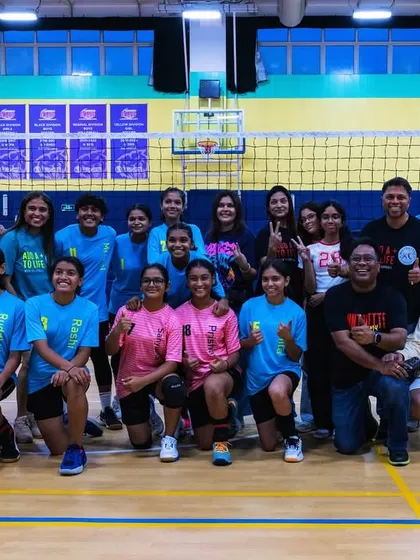 The complete team photo with our supporters after the final win. This picture represents the strong community that backs our players.