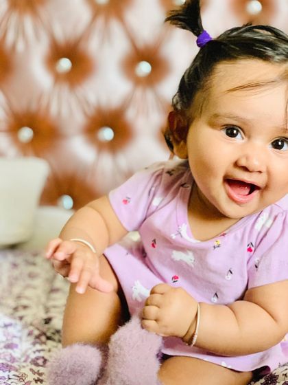 My little doll posing for the camera. Love dressing her up in cute outfits.