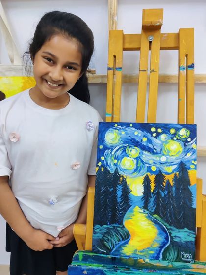 A young student recreates Van Gogh's "Starry Night," learning about impressionistic style and bold color application.