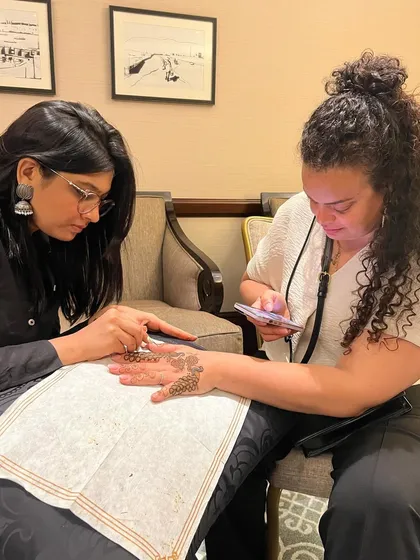 It was a pleasure to do a quick mehendi for a talented makeup artist from France. This photo captures the moment of creation and cultural exchange, as she documents the process.