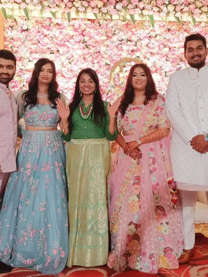 A group photo with both couples, celebrating a truly unique and memorable event.