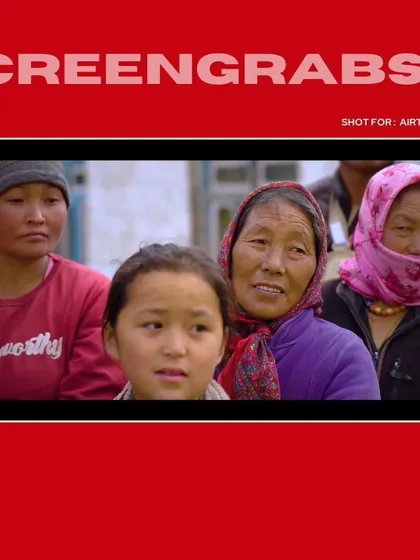 A close-up on the faces of the local community members, capturing their authentic reactions and telling a story without words for the Airtel film.