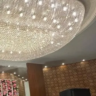 Another angle of the stunning chandelier, showing how it illuminates the entire space and adds a touch of opulence to the event.