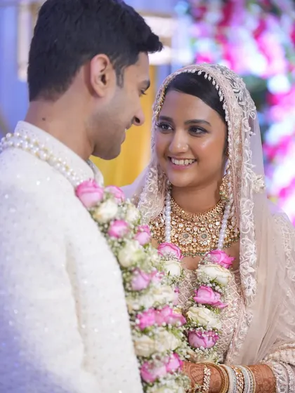 A close-up of the bride and groom sharing a happy, candid moment right after their ceremony.