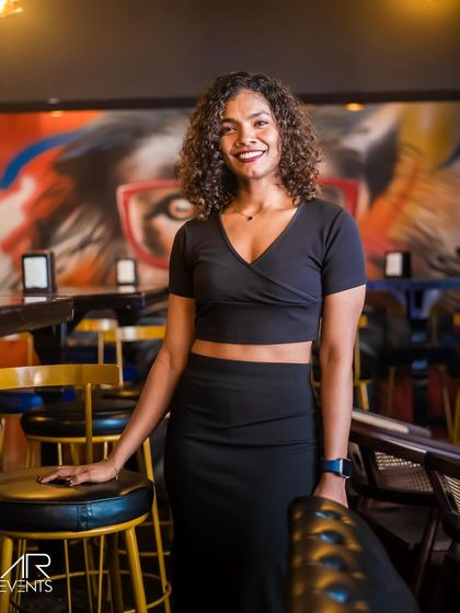 A guest posing against the venue's signature graffiti wall.