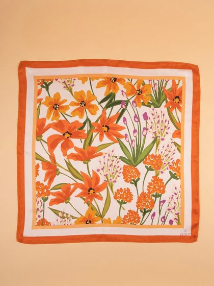 A flat-lay of the orange floral pocket square, perfect for showcasing the full print.