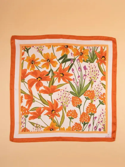 A flat-lay of the orange floral pocket square, perfect for showcasing the full print.