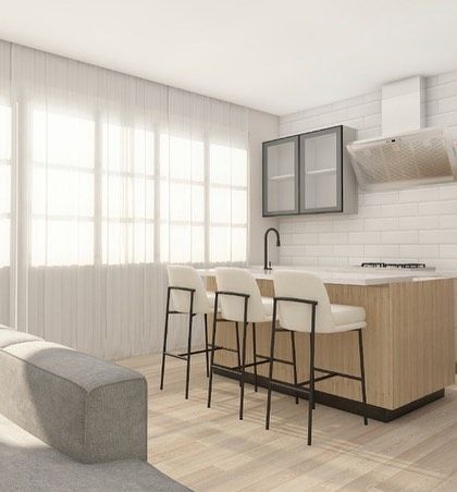 Another view of the open kitchen and living area. The large windows allow for plenty of natural light, which is a key element of Scandinavian design.