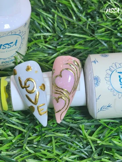 This design showcases the smooth application of our NSSA gel polishes, used as a base for golden heart scrollwork and "LOVE" lettering. Our polishes ensure a flawless foundation for any nail art.