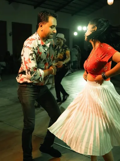 Capturing the motion and joy of a fast-paced Salsa spin at the Goa International Dance Congress.