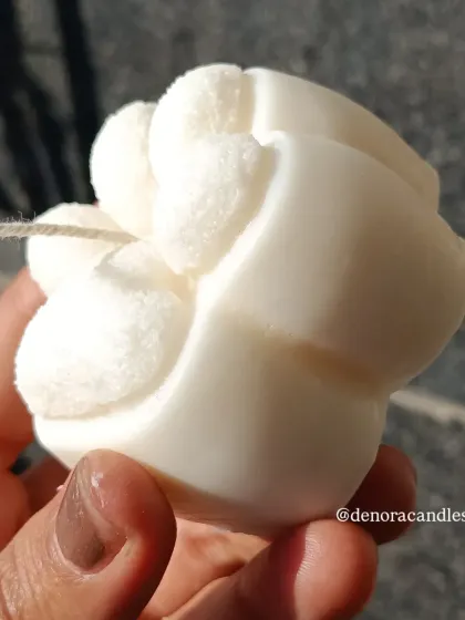 A side view of the paw candle.