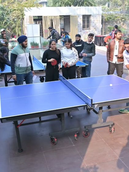 Guests enjoy a game of table tennis in our courtyard during an Open Day. We offer a relaxed and social environment where people can connect and have fun.
