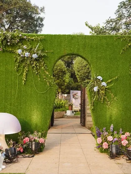 I also design whimsical events like this "Alice in Wonderland" themed baby shower. A mossy green archway with playful props like mushrooms and the White Rabbit welcomes guests into a magical world.