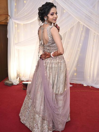 A back view of the client, showing the elegant back design of the blouse.