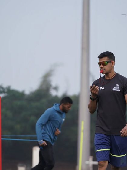 It's not done until it's done. Overseeing a resisted running drill, ensuring the athlete maintains proper form and intent throughout the exercise to maximize speed development.