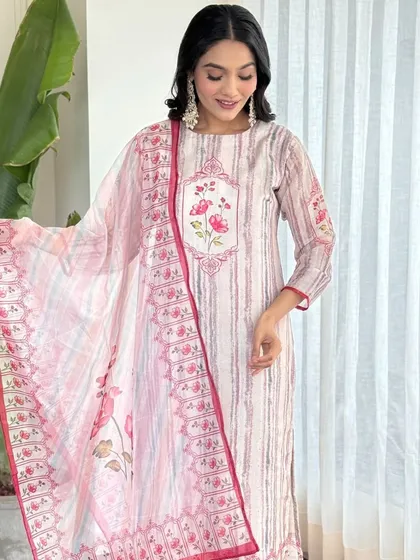 This off-white pure muslin kurta set is all about subtle stripes and floral details. It's a versatile piece that you can style for both casual and semi-formal occasions.