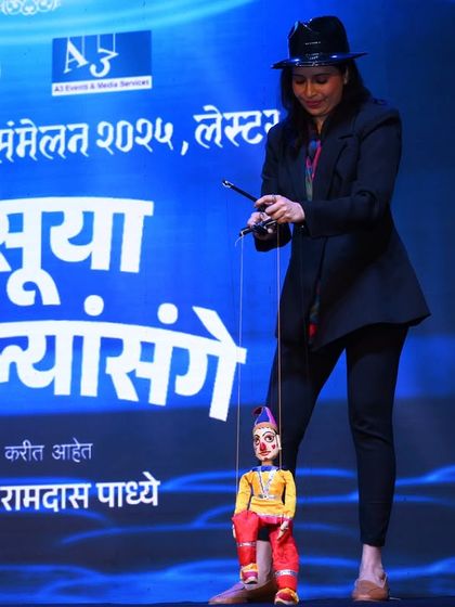 My wife Rujuta, a skilled puppeteer and pre-school teacher, performing with a string puppet at the European Marathi Sammelan. Her expertise is a huge asset to our team.