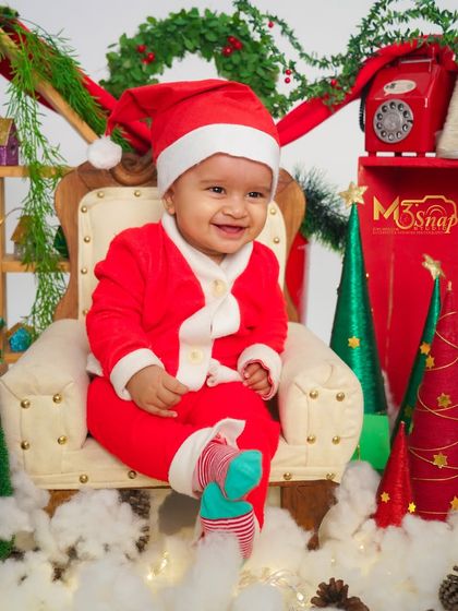 A joyful, smiling portrait from the Santa-themed photoshoot. Capturing these happy expressions is what the holiday spirit is all about.