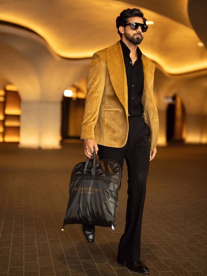 Travel in style with our mustard velvet blazer. It's a versatile piece that adds a touch of luxury to any outfit.
