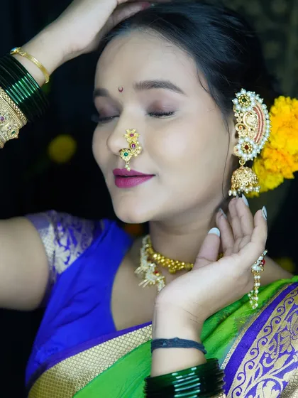 A close-up showing the soft eye makeup and traditional jewelry for the Gudi Padwa look.