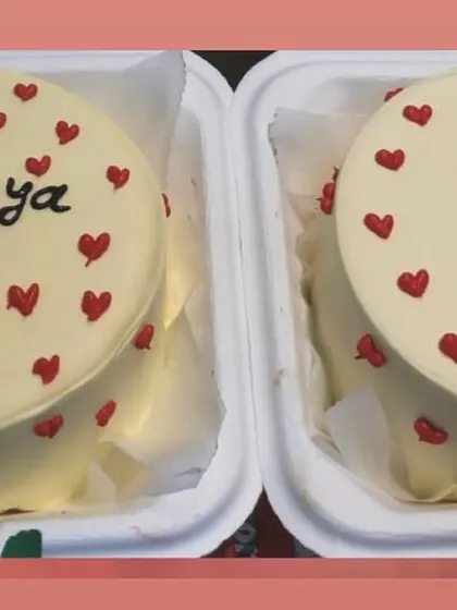 A set of matching bento cakes for a 20th birthday, decorated with a simple and cute heart pattern.