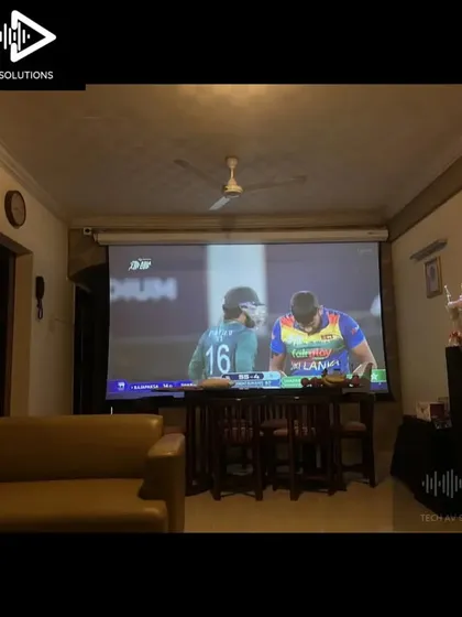 The final result: watching a live cricket match on a massive projector screen. This is what a great home theater system is all about, bringing family and friends together for an immersive entertainment experience.