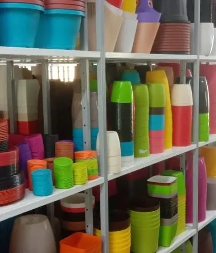 A close-up of our plastic pot selection, highlighting the variety of modern designs and vibrant colors available.