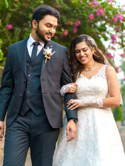 A romantic walk with her new husband. The makeup is designed to last through the ceremony and photos, keeping her looking fresh and beautiful.