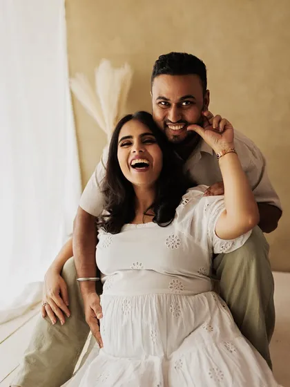 A moment of pure, unscripted laughter during a lifestyle maternity session. This is what it's all about: capturing the real, joyful connection between a couple.