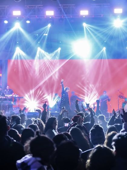 A wide shot of our New Year's Eve concert, showcasing the impressive light show and the massive crowd that came to celebrate with us.