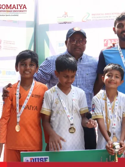 Coaches and players from the victorious U-9 team pose with their awards at the DUSF Football Fiesta.