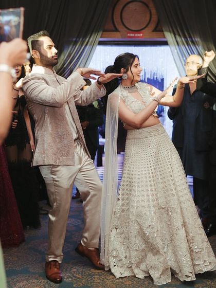 A fun, synchronized couple's dance during their Roka ceremony. I teach moves that are easy to learn but look incredibly effective, ensuring you both look like stars on the dance floor.