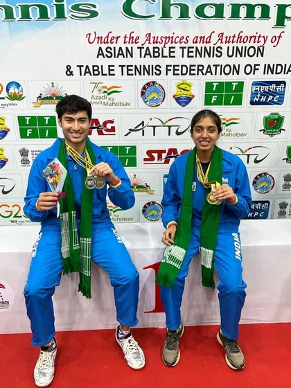 Yashaswini and her mixed doubles partner celebrating their gold medal win.