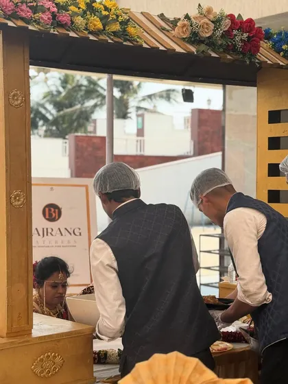 My staff is trained to be attentive and professional. Here, we are serving the main couple, ensuring their needs are met throughout the event.