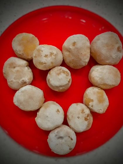 Love is in the air, and in my kitchen. These are my experimental baked doughnut bites, arranged in a heart shape for Valentine's Day. They are light, fluffy, and a sweet way to show you care.