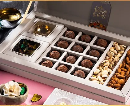 Our most luxurious Diwali gift box, featuring compartments filled with chocolate truffles, pistachios, and almonds. It's an elegant and impressive gift.