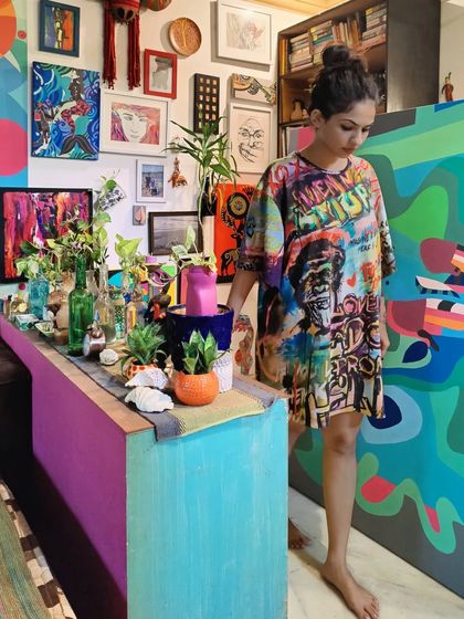 The artist in the studio, surrounded by finished and in-progress canvases, a space bristling with Picassos.