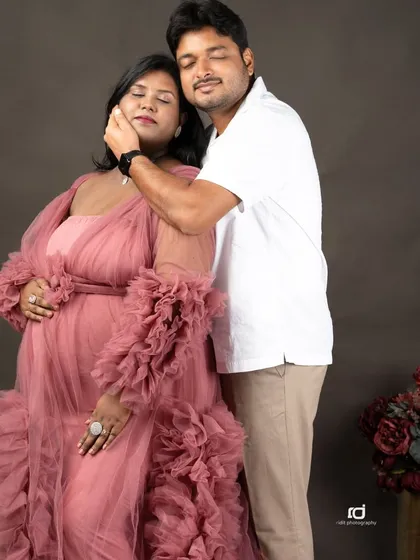 A moment of pure bliss. The genuine emotion in this pose, with eyes closed and a gentle caress, makes for a truly heartfelt maternity photograph.