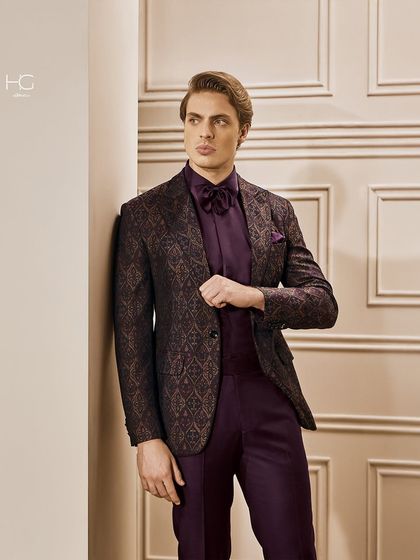 This look is for when subtle royalty meets a modern vision. I crafted this suit in a rich plum jacquard fabric, perfect for making a sophisticated and regal statement at any formal event.