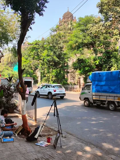 A typical workday, sketching on a sidewalk in Mumbai. My process is grounded in direct observation, finding art in the everyday flow of the city and its people.